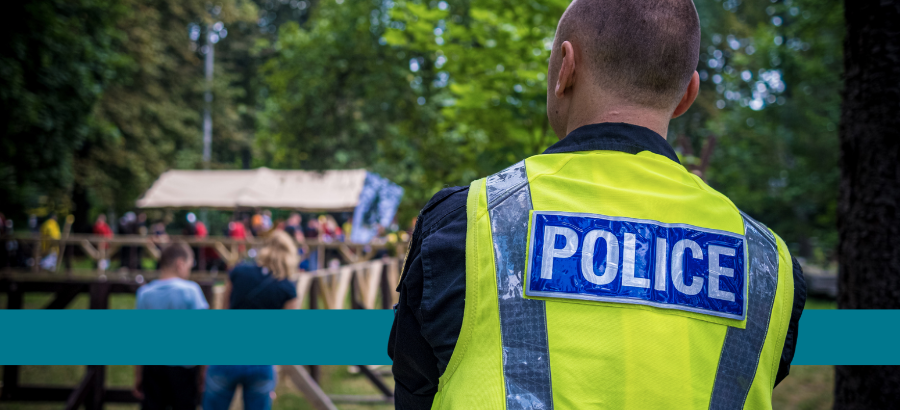 Policeman looking to a crowd}